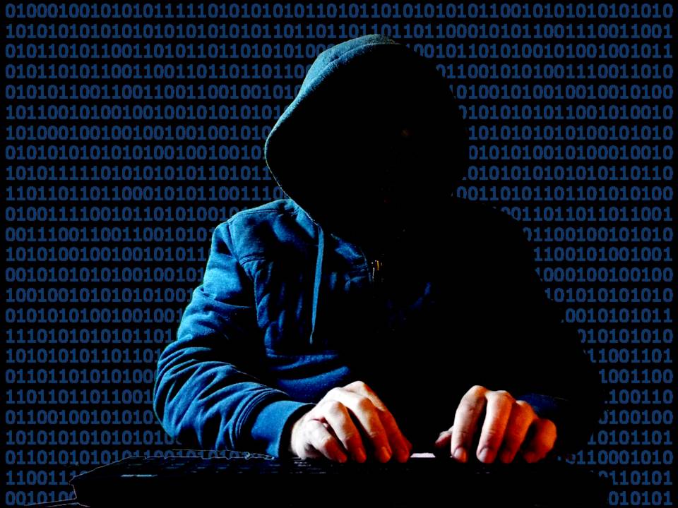 hacker typing in front of binary code background
